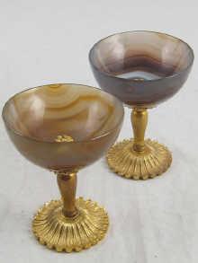 Appraisal: A pair of carved agate hemispherical bowls on gilt metal