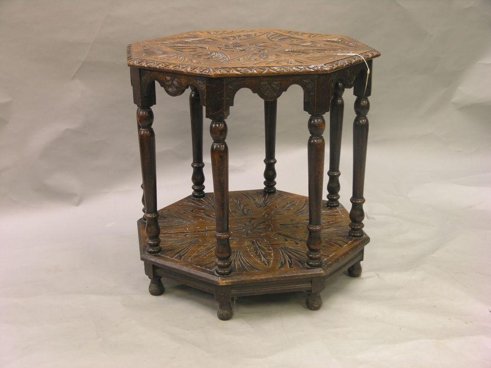 Appraisal: A late Victorian dark carved oak centre table octagonal shape