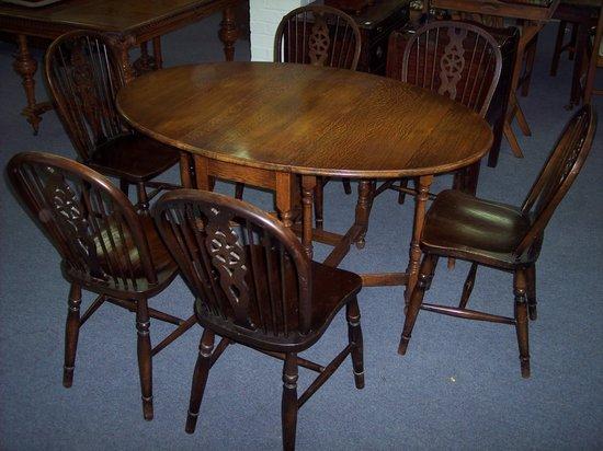 Appraisal: An oak two-flap table the rectangular top above two D-shaped