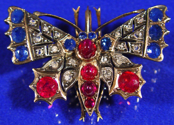 Appraisal: Two colour gold diamond sapphire and ruby butterfly brooch