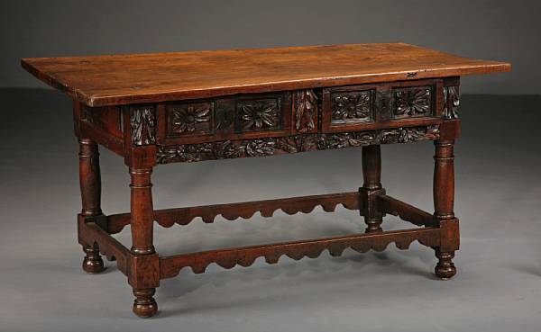 Appraisal: A Spanish Baroque walnut library table The rectangular top over