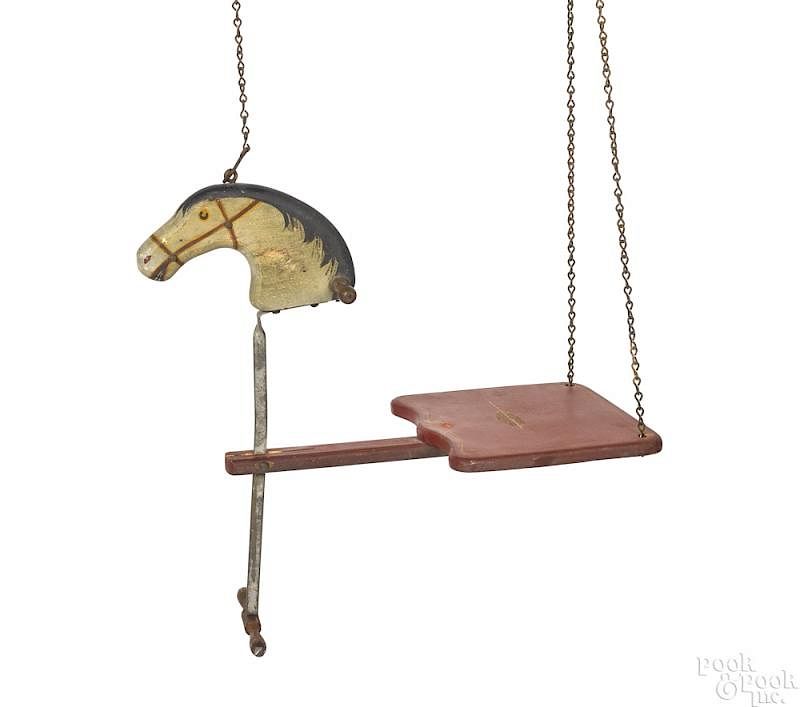 Appraisal: Carved and painted pine horse head child's swing Carved and