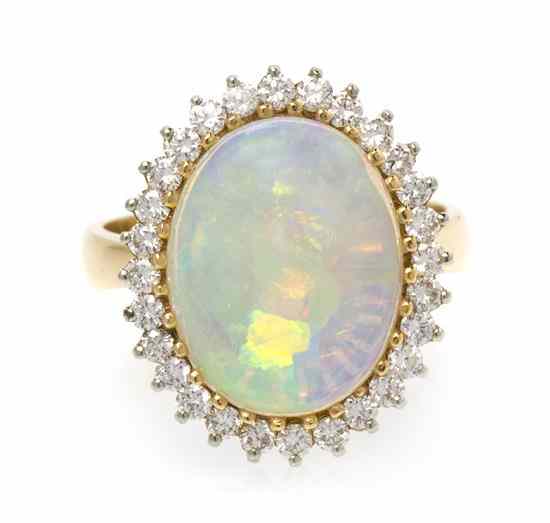 Appraisal: A Yellow Gold Opal and Diamond Ring containing one cabochon