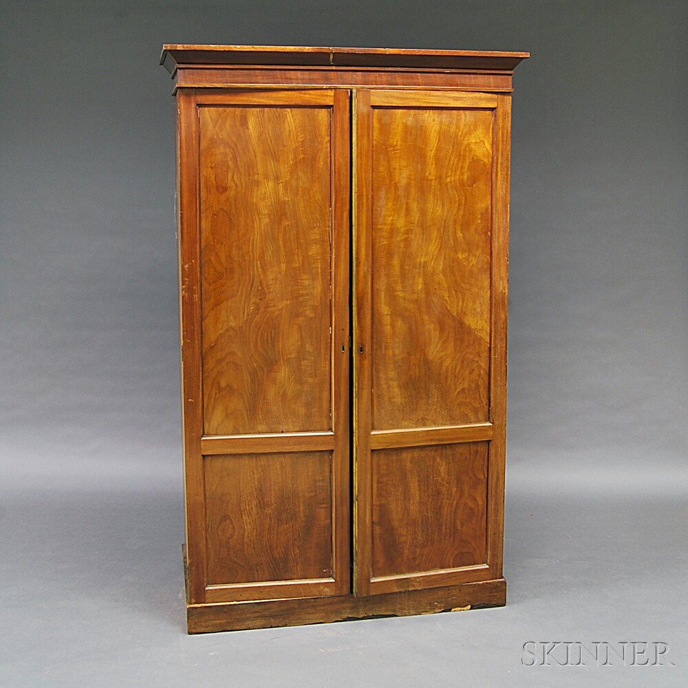 Appraisal: Walnut Veneer Two-door Armoire th century the molded cornice over