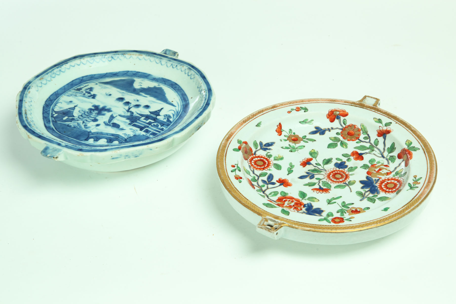 Appraisal: TWO WARMING PLATES China th century porcelain Canton ''d and