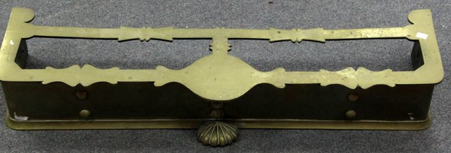 Appraisal: A Victorian brass fender with central kettle stand cm wide