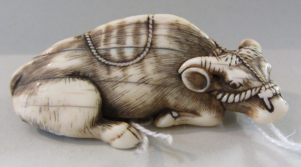 Appraisal: School of Tomotada early th century an ivory netsuke of