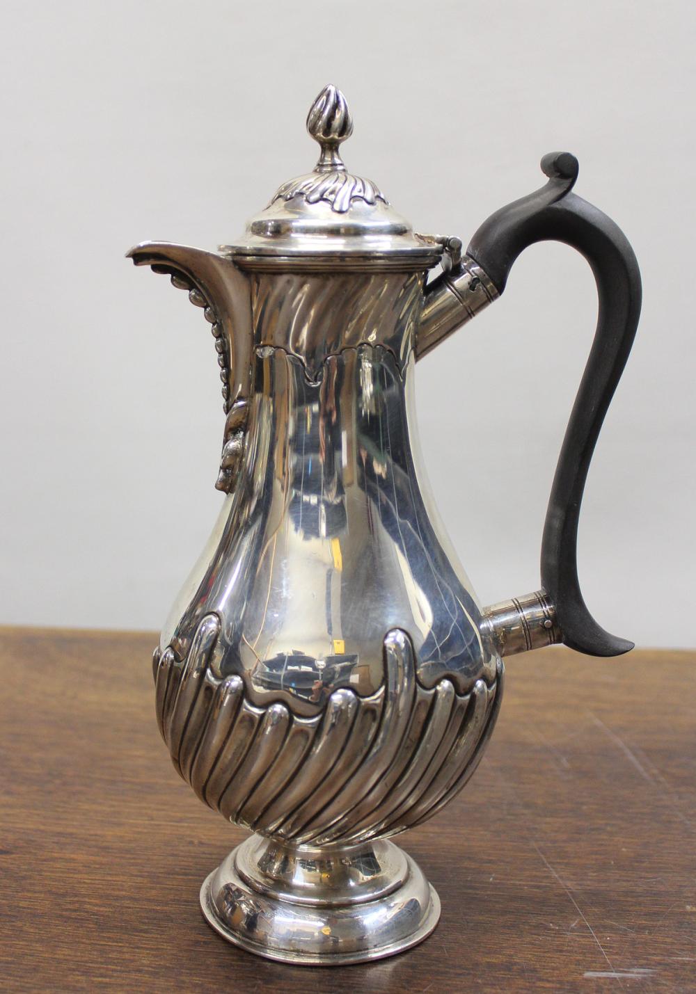 Appraisal: ENGLISH STERLING SILVER COFFEE POT with wooden handle hallmarked London