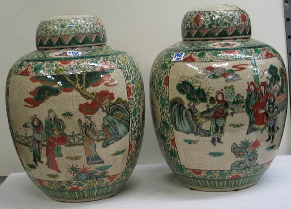 Appraisal: PAIR CHINESE POTTERY COVERED TEMPLE JARS hand painted with cartouches