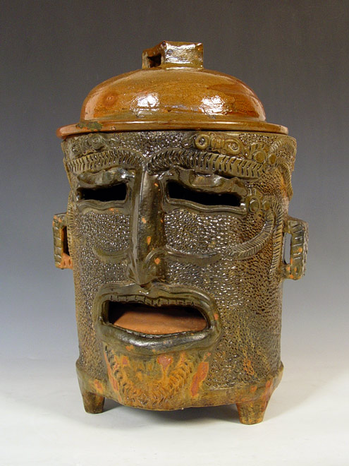 Appraisal: WHIMSICAL POTTERY JUG HEAD SMOKER Late th century Mayan smoker