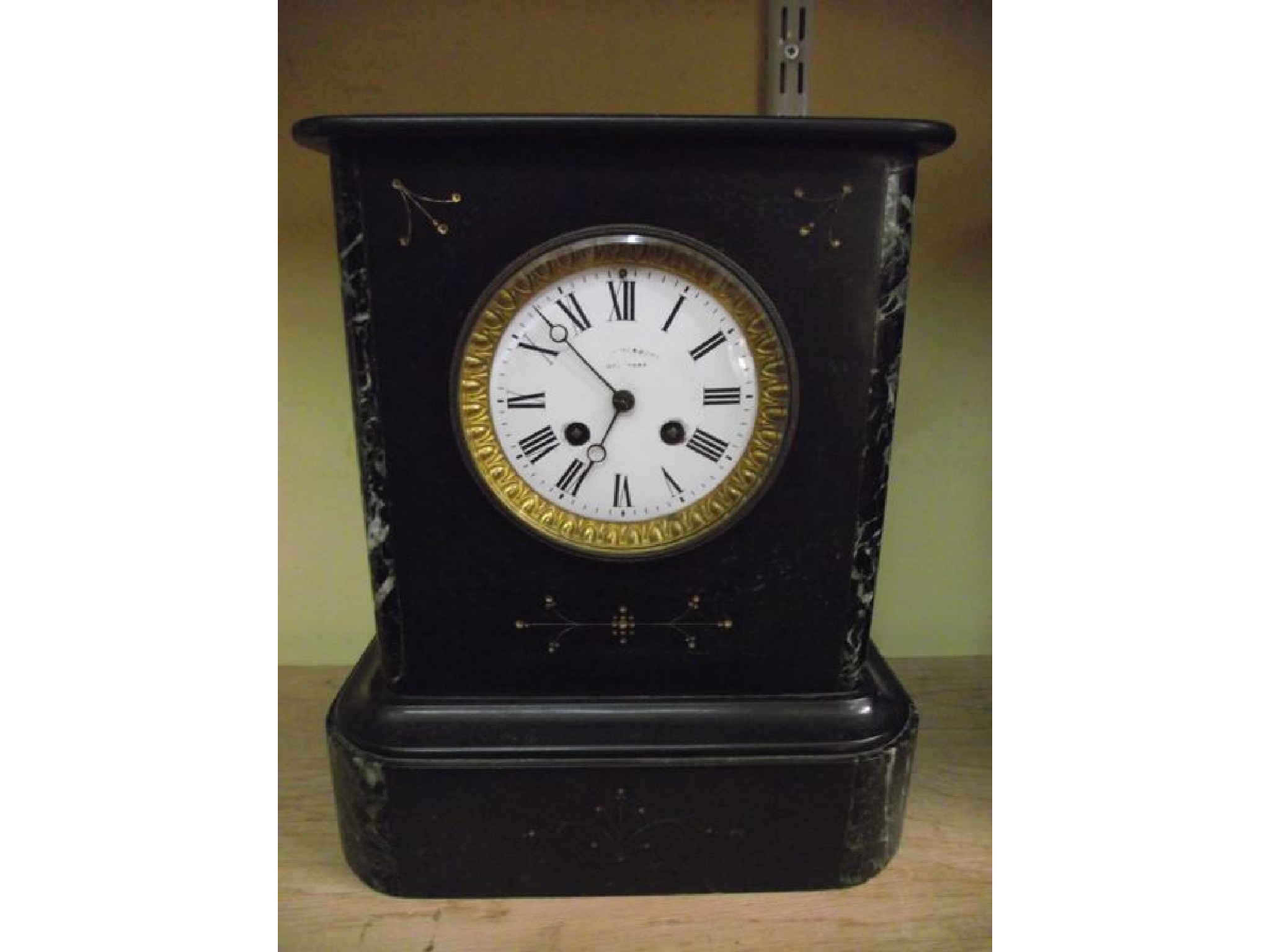 Appraisal: A th century black slate and marble mantel clock with