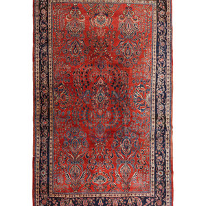 Appraisal: A Sarouk Wool Rug Mid- th Century feet inches x