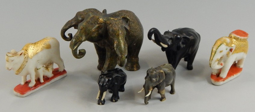 Appraisal: A group of animals including a bronze three headed Hindu