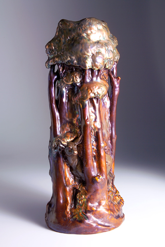 Appraisal: ZSOLNAY Tall and elaborate vase with a doe peeking out