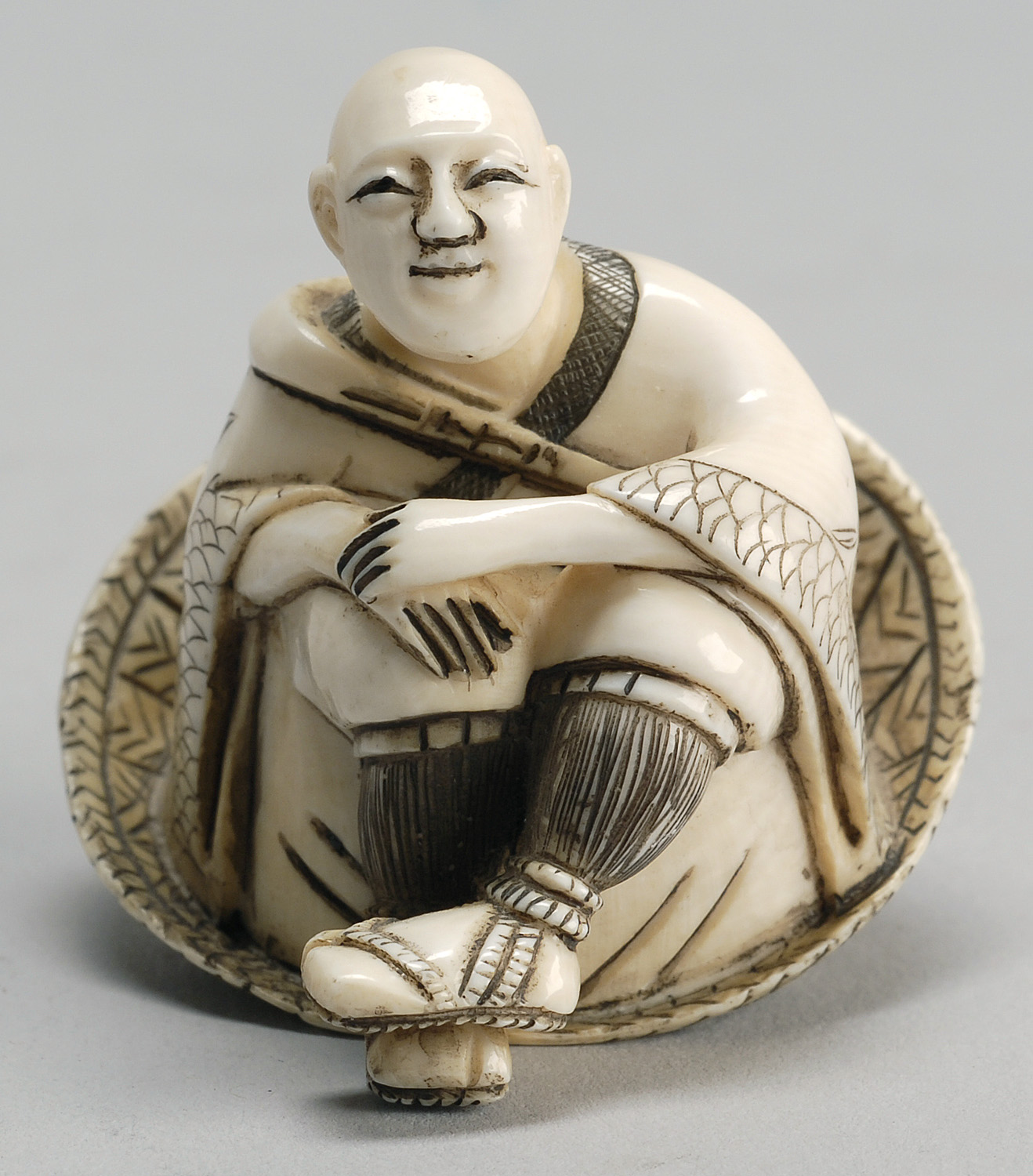 Appraisal: IVORY NETSUKE th CenturyIn the form of a man seated