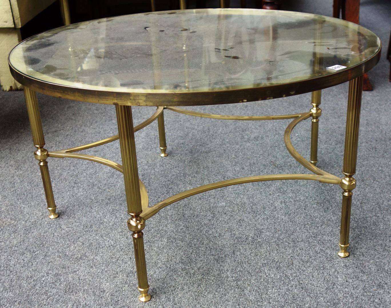 Appraisal: A th century circular brass and glass coffee table and