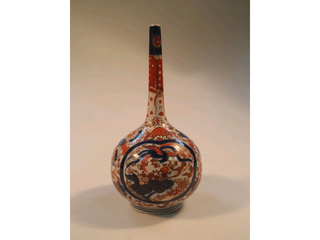 Appraisal: A Japanese Imari bottle vase with a slender tapering neck