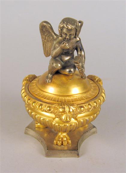 Appraisal: Gilt and silvered bronze Cupid inkwell late th century Cupid