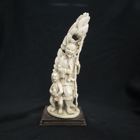 Appraisal: Chinese Carved Ivory Figurine of Old Man boy with fish