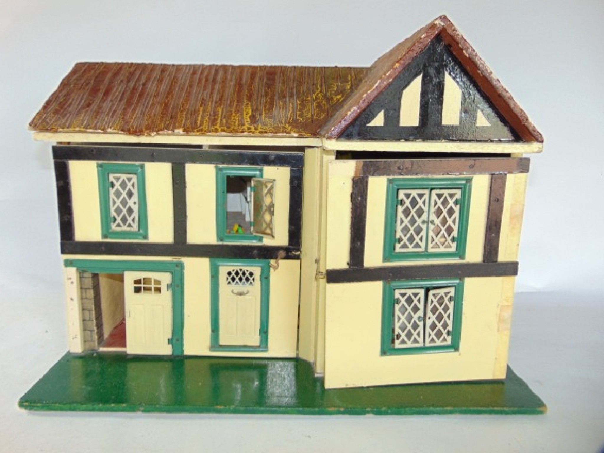 Appraisal: A th century dolls house with hinged fa ade over