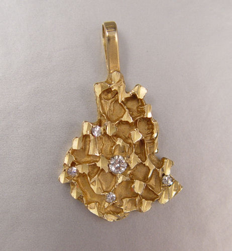 Appraisal: K NUGGET DIAMOND PENDANT K yellow gold nugget style pendant