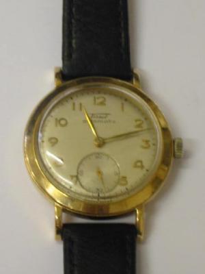 Appraisal: A GENTLEMAN'S TISSOT AUTOMATIC CT GOLD WATCH the circular silvered