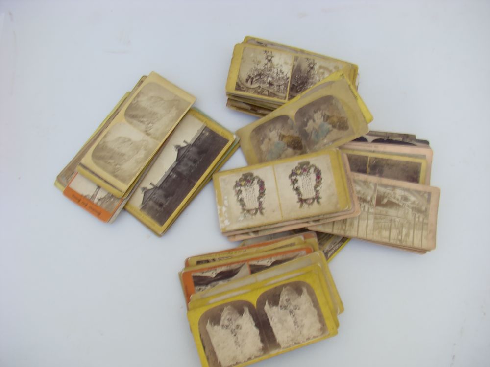 Appraisal: SIXTY-SEVEN STEREOPTICON CARDS WITH WOODEN VIEWER Late th Early th