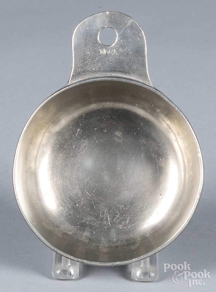 Appraisal: American tab handled pewter porringer American tab handled pewter porringer