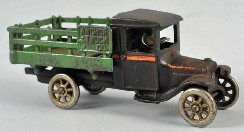 Appraisal: Cast Iron Arcade Stake-Back Truck Toy American Nickel wheels and