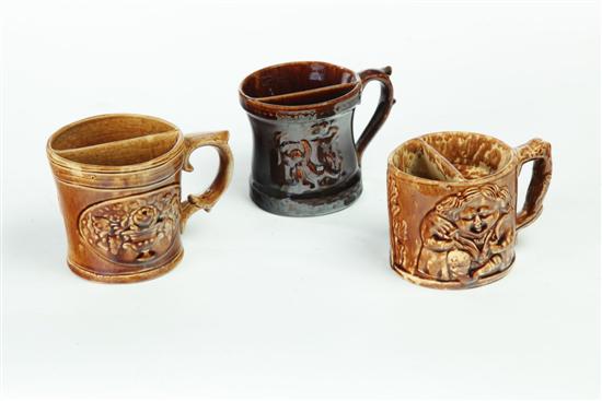 Appraisal: THREE ROCKINGHAM SHAVING MUGS Seated Toby marked Swan Hill Pottery