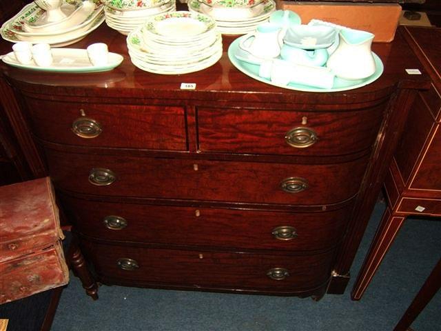 Appraisal: A William IV mahogany bow fronted chest of two short