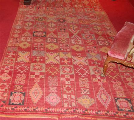 Appraisal: MOROCCAN CARPET TH CENTURY the red field with allover polychrome