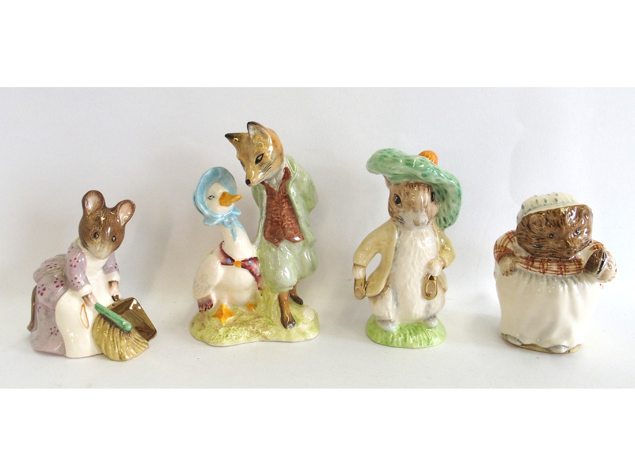 Appraisal: Three Beswick gold backstamp Beatrix Potter figures including Mrs Tiggy