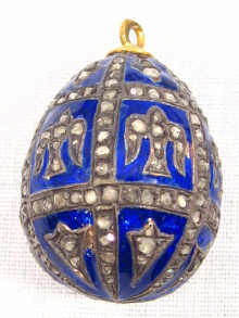 Appraisal: A blue enamelled Russian egg profusely set with rose cut