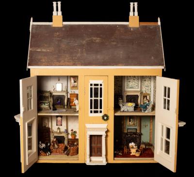 Appraisal: A large early th Century doll's house of eight rooms