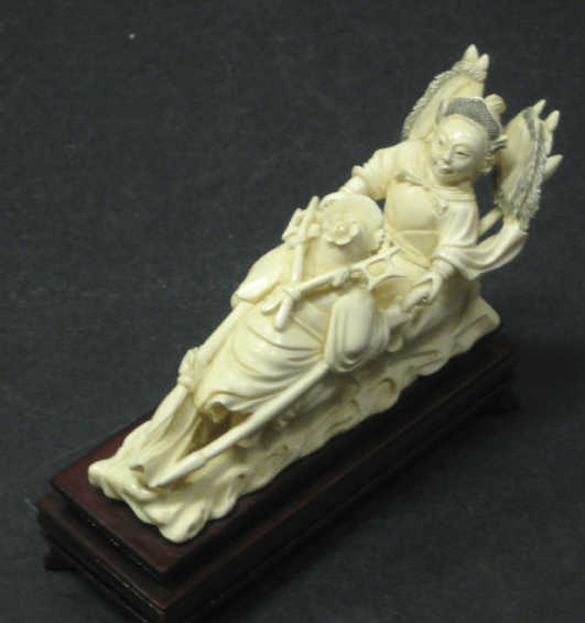 Appraisal: CHINESE CARVED IVORY FIGURE GROUP Depicting a man and woman