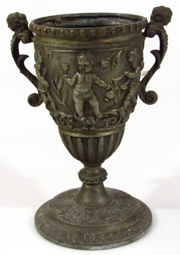 Appraisal: A Victorian cast iron vase the urn shaped body raised