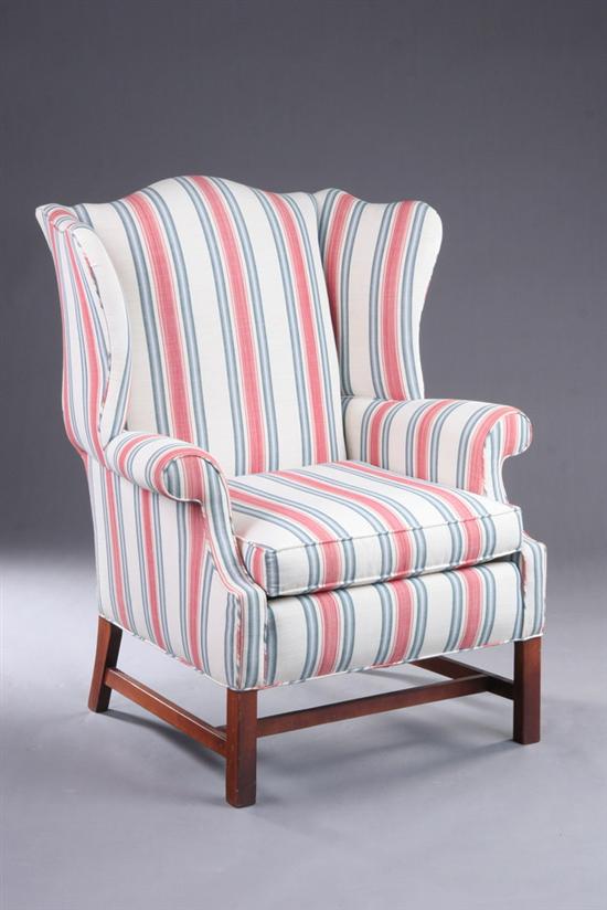 Appraisal: CONTEMPORARY CHIPPENDALE STYLE EASY CHAIR th century Arched padded back