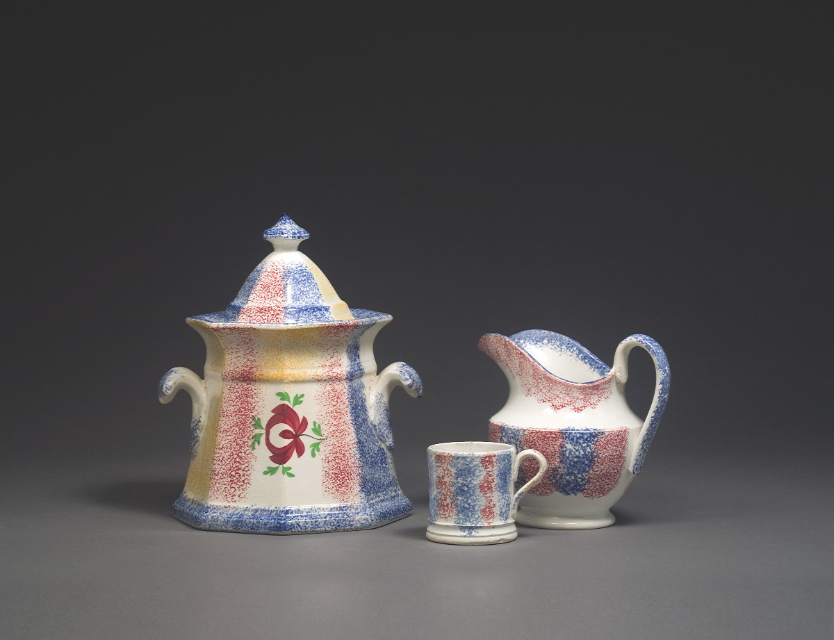 Appraisal: STAFFORDSHIRE RED AND BLUE SPATTERWARE CHILDREN'S WATER PITCHER AND A