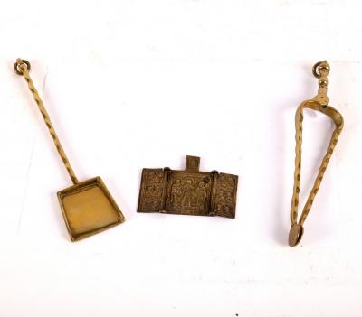 Appraisal: A Russian brass triptych and two miniature brass fire irons