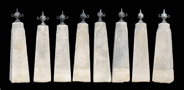 Appraisal: A set of eight French stone and cast iron boundary