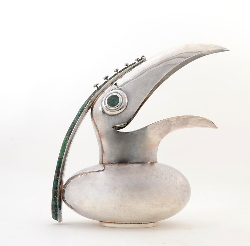 Appraisal: LOS CASTILLOS TOUCAN FORM PITCHER Silver plated pitcher with figural