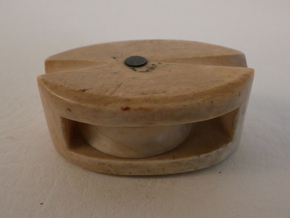 Appraisal: MINI BONE PULLEY BLOCK th century sailor made carved bone