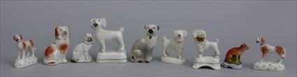 Appraisal: GROUP OF STAFFORDSHIRE SMALL DOG FIGURES AND A FOX Comprising