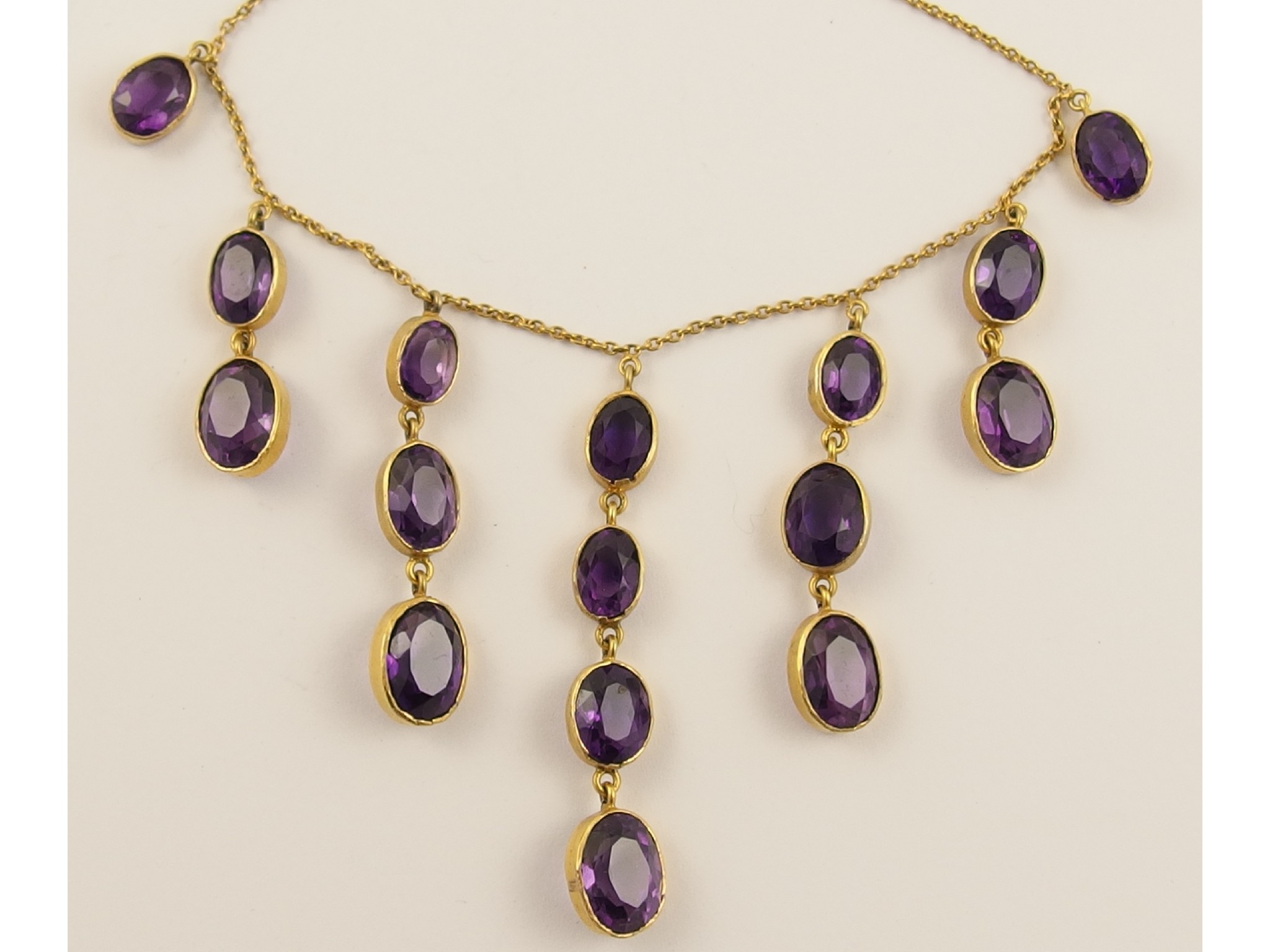 Appraisal: A ct amethyst festoon necklaceset with sixteen amethysts rub over