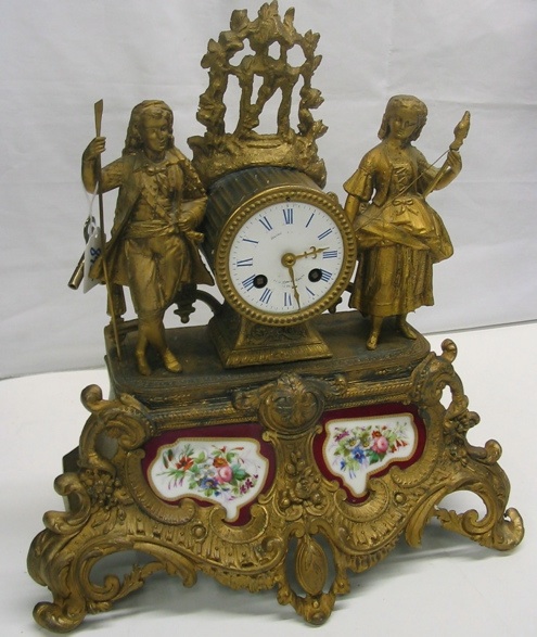 Appraisal: A FRENCH FIGURAL MANTEL SHELF CLOCK The gilt metal case