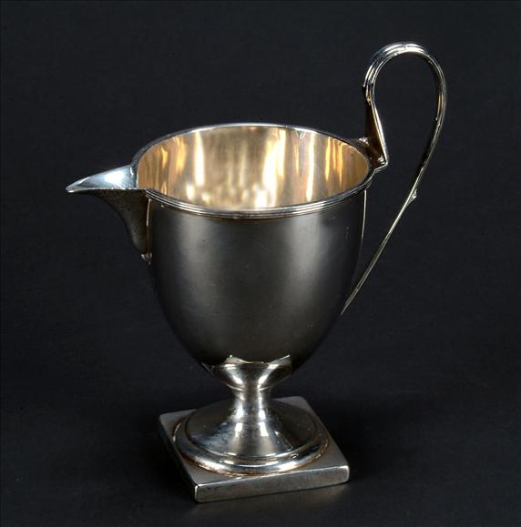 Appraisal: A George III silver circular pedestal cream jug by Charles