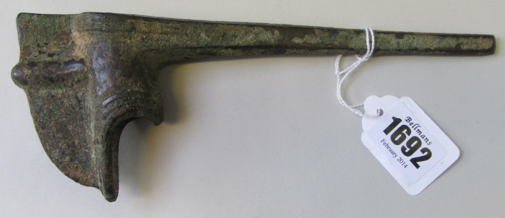 Appraisal: An Ancient Near Eastern bronze adze with a long narrow