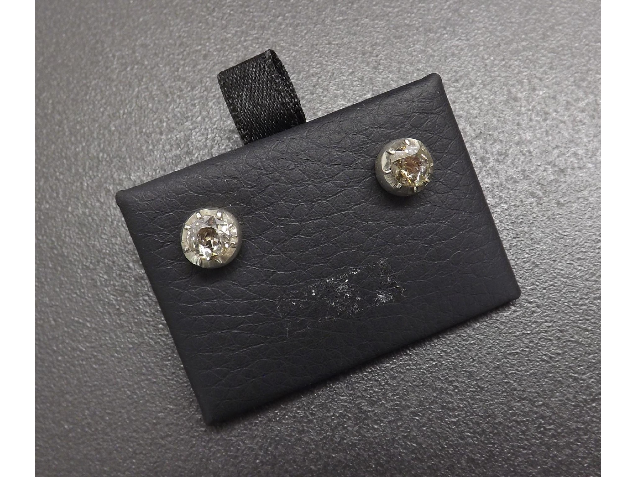 Appraisal: Pair of old round-cut diamond ear studs rub-over set in