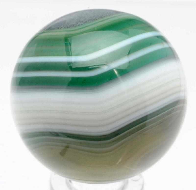 Appraisal: Hand Faceted Bullseye Green-Dyed Agate Marble Finely faceted marble with